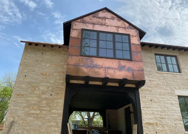 Copper metal panel facade on a stone building for Skylight Installation in Lindenwold