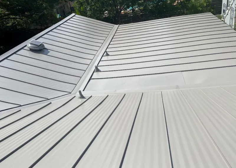 Solar attic fan installed on a metal roof for Roof Ventilation in Lindenwold